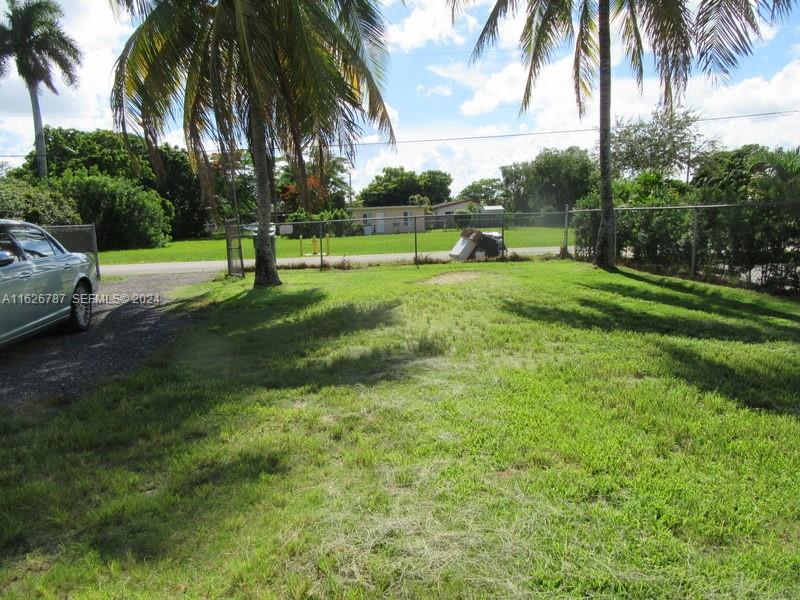 24925 Southwest 134th Court Homestead, FL 33032 - Photo 20 of 37 a view of a park with palm trees