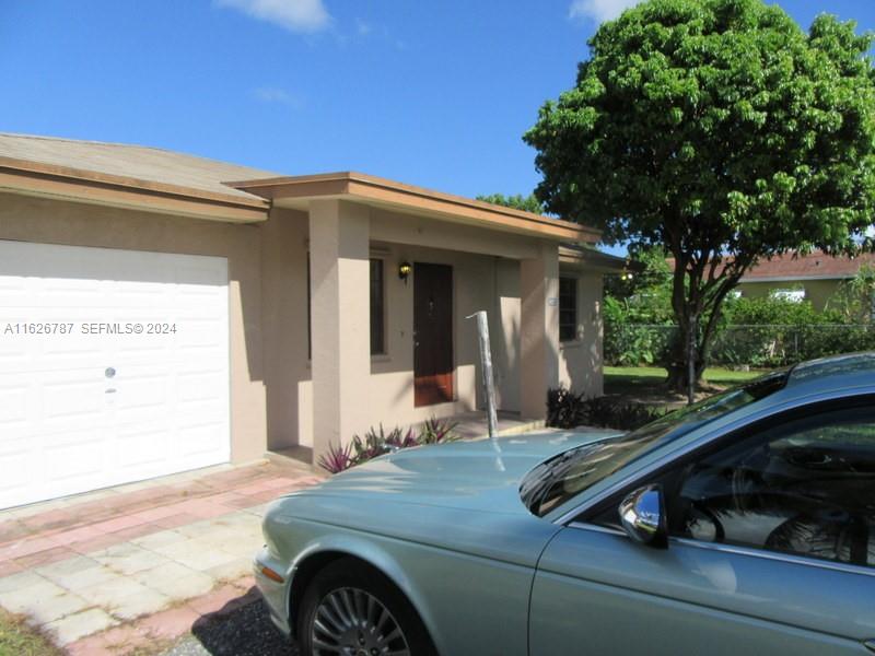 24925 Southwest 134th Court Homestead, FL 33032 - Photo 22 of 37 a front view of a house with garden