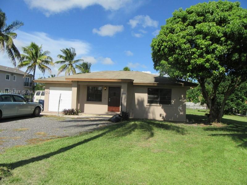 24925 Southwest 134th Court Homestead, FL 33032 - Photo 24 of 37 a view of a house with a yard and sitting area