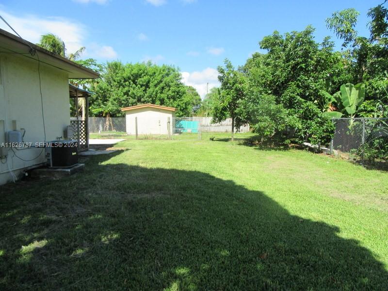 24925 Southwest 134th Court Homestead, FL 33032 - Photo 30 of 37 a view of a backyard of the house