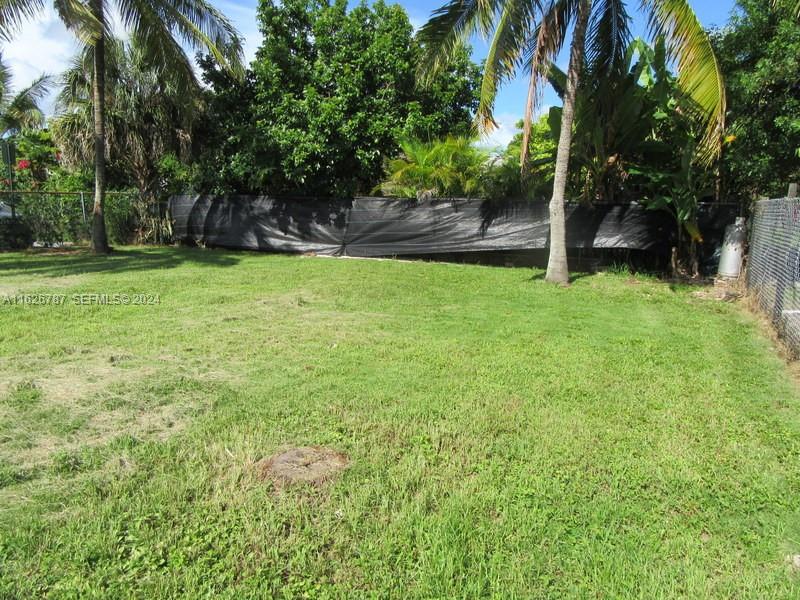 24925 Southwest 134th Court Homestead, FL 33032 - Photo 35 of 37 a view of a yard with a tree