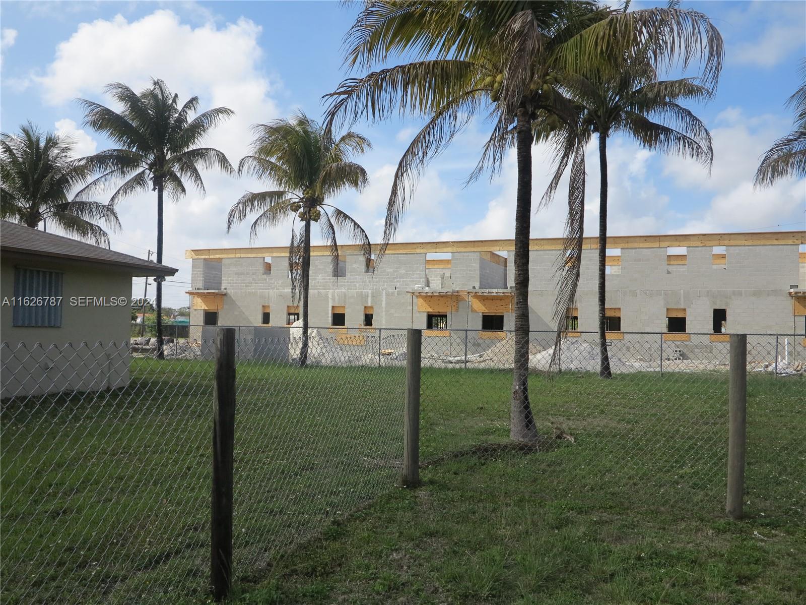 24925 Southwest 134th Court Homestead, FL 33032 - Photo 6 of 37 a view of a yard with a palm tree