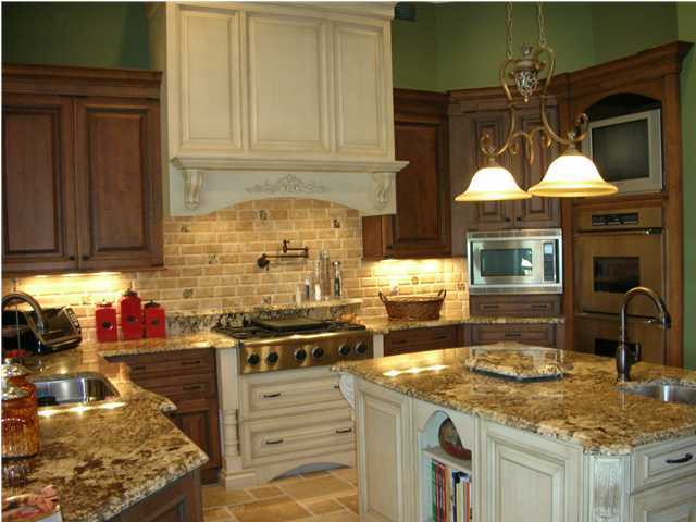 2945 Pine Valley Road Miramar Beach, FL 32550 - Photo 2 of 20 a kitchen with stainless steel appliances granite countertop a stove a sink and a microwave