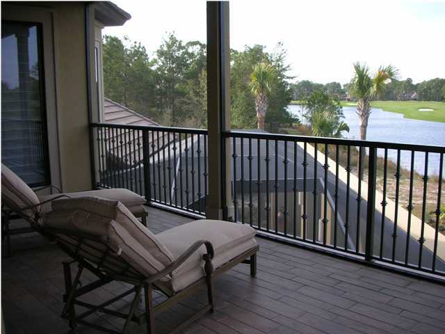 2945 Pine Valley Road Miramar Beach, FL 32550 - Photo 13 of 20 a balcony with a table and chairs