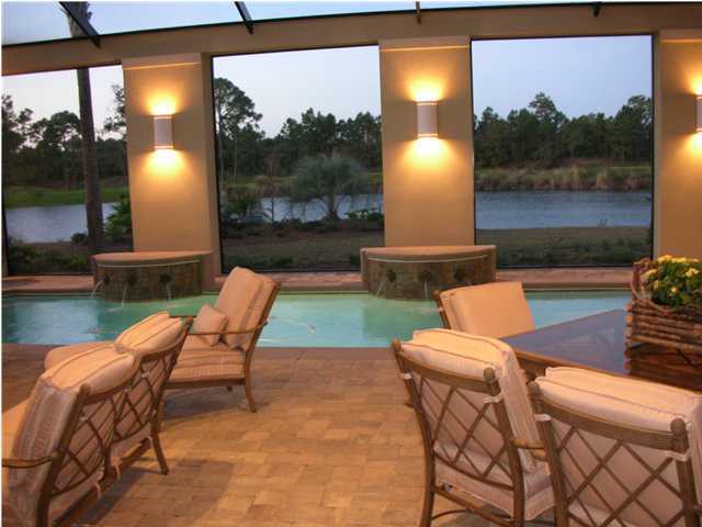 2945 Pine Valley Road Miramar Beach, FL 32550 - Photo 15 of 20 a view of a patio with a table chairs and a fire pit