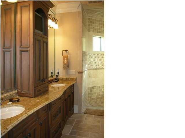 2945 Pine Valley Road Miramar Beach, FL 32550 - Photo 7 of 20 a bathroom with a double vanity sink and a mirror