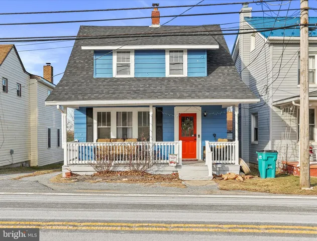 a view of a house with a small white house
