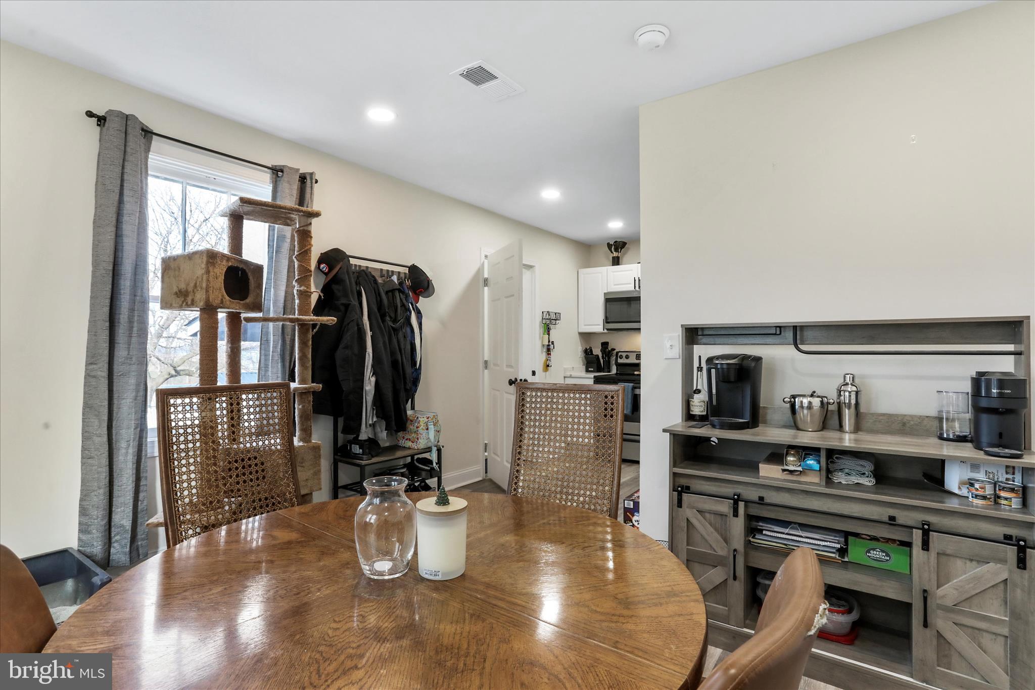 8118 Mapleville Road Boonsboro, MD 21713 - Photo 11 of 30 a kitchen with a refrigerator and a table