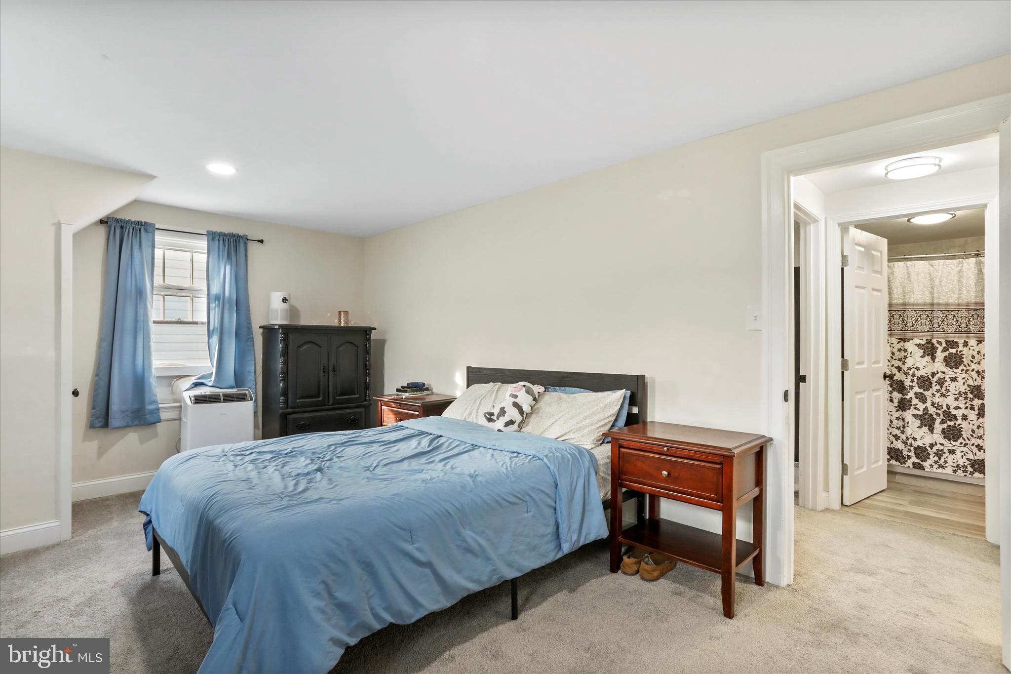 8118 Mapleville Road Boonsboro, MD 21713 - Photo 15 of 30 a bedroom with a bed and a television