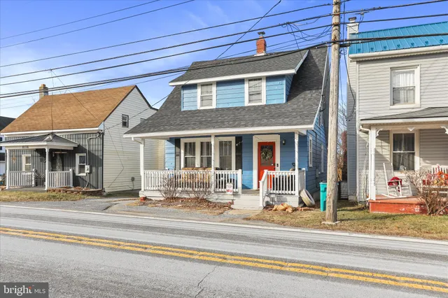 a view of a brick building next to a yard