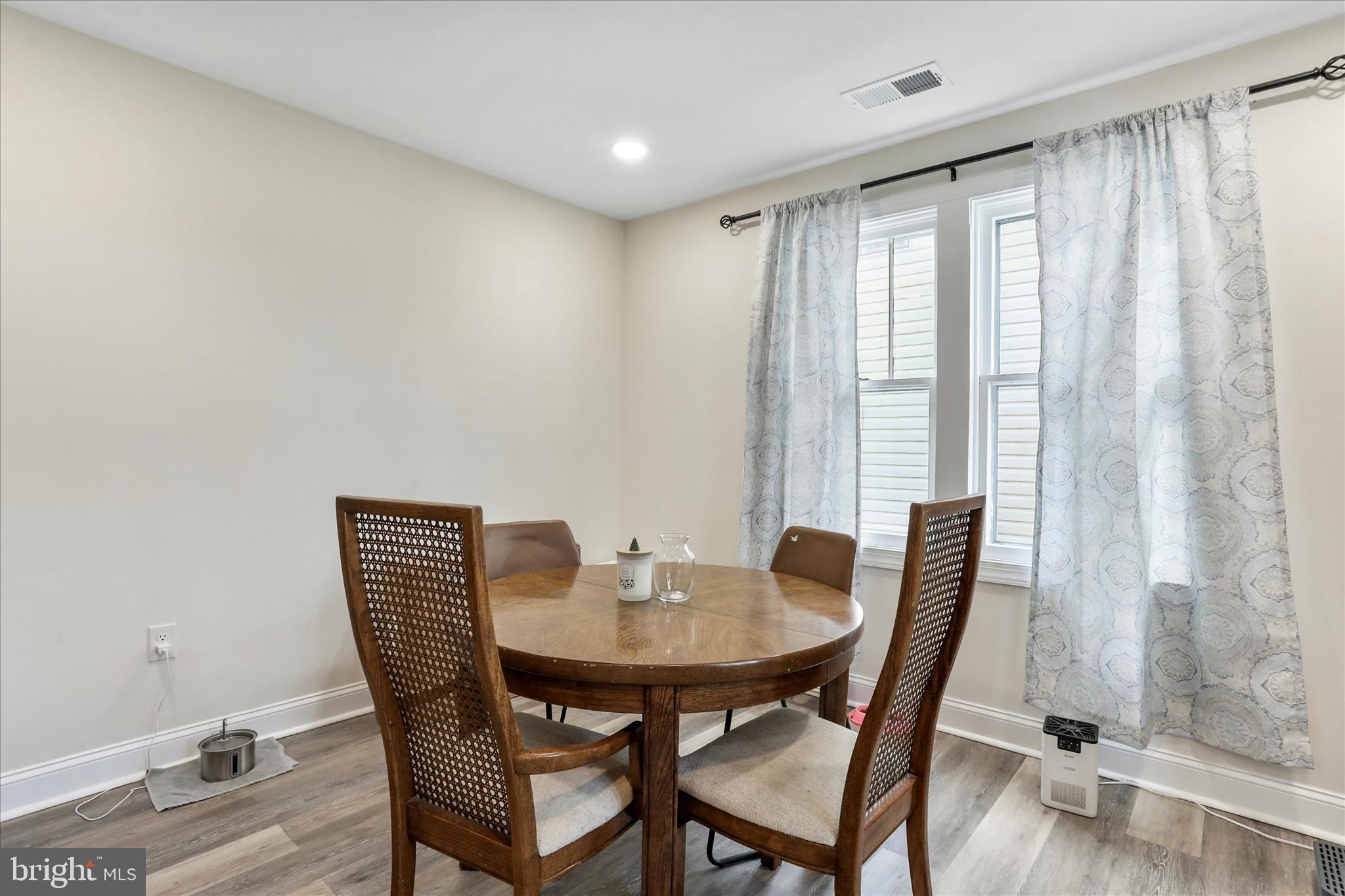 8118 Mapleville Road Boonsboro, MD 21713 - Photo 10 of 30 a view of a dining room with furniture and wooden floor