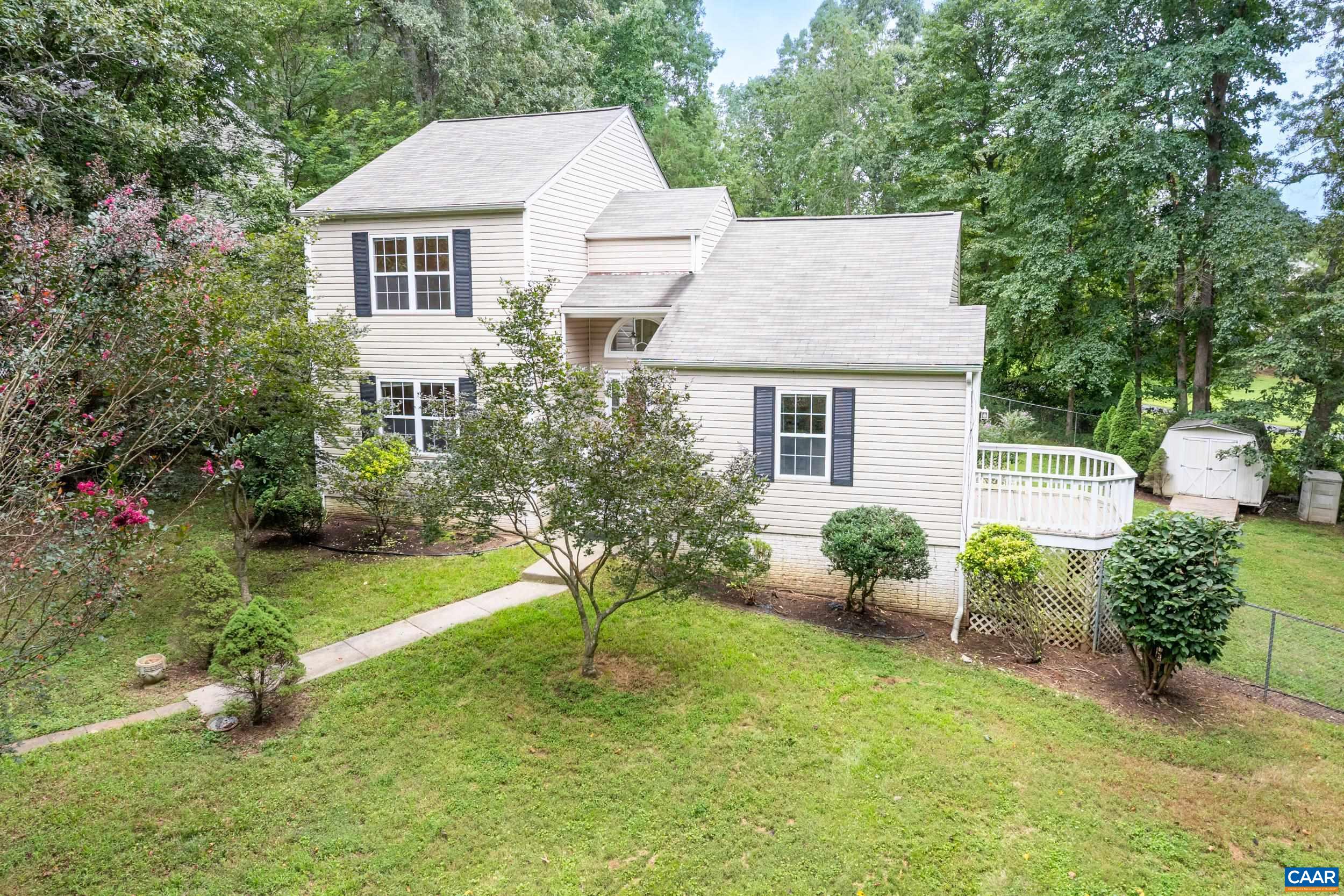 183 Rustling Oaks Way Ruckersville, VA 22968 - Photo 1 of 52 a house view with a garden space