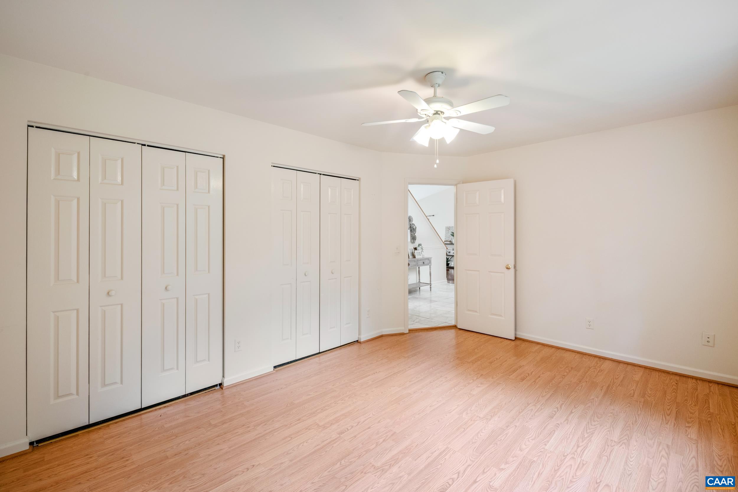 183 Rustling Oaks Way Ruckersville, VA 22968 - Photo 31 of 52 an empty room with wooden floor fan and windows