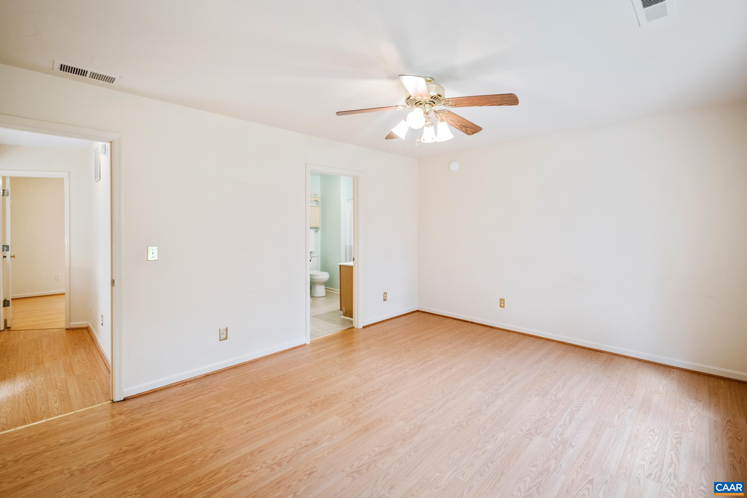 183 Rustling Oaks Way Ruckersville, VA 22968 - Photo 33 of 52 an empty room with wooden floor fan and windows