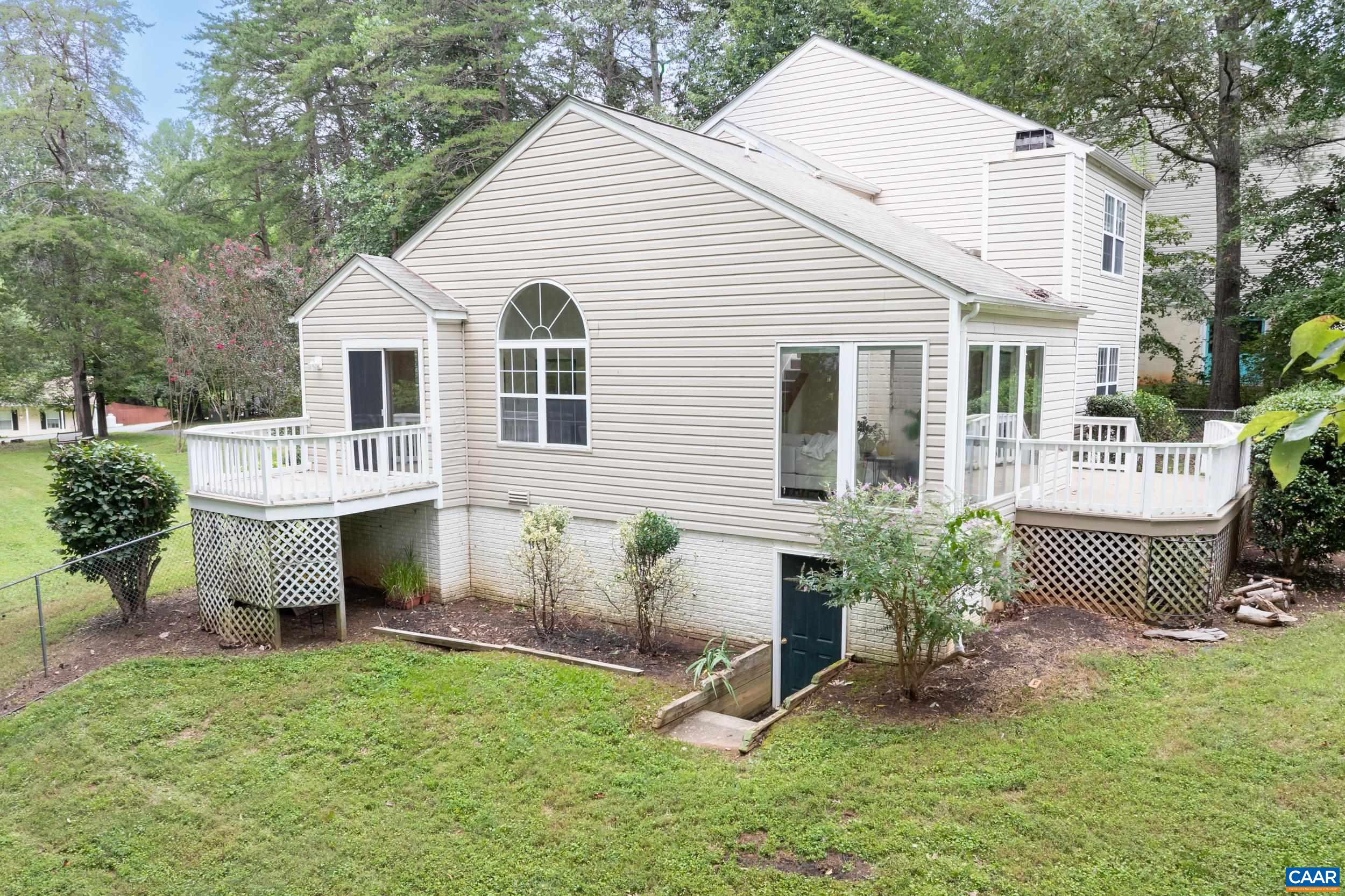 183 Rustling Oaks Way Ruckersville, VA 22968 - Photo 44 of 52 a front view of a house with a yard and outdoor seating