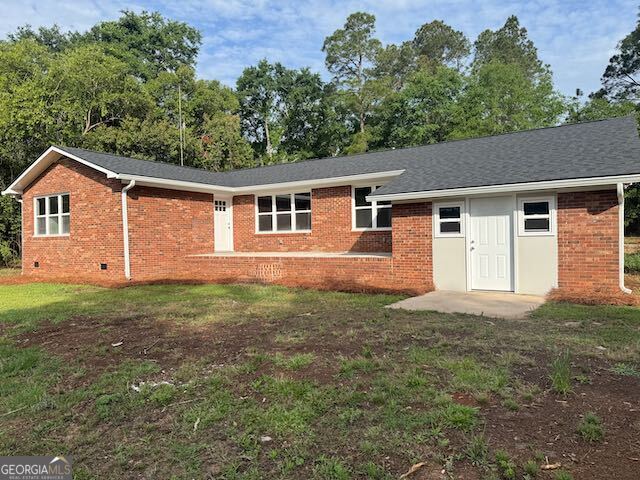 2809 Jones Road Sandersville, GA 31082 - Photo 2 of 31 a view of a house with yard and a garden
