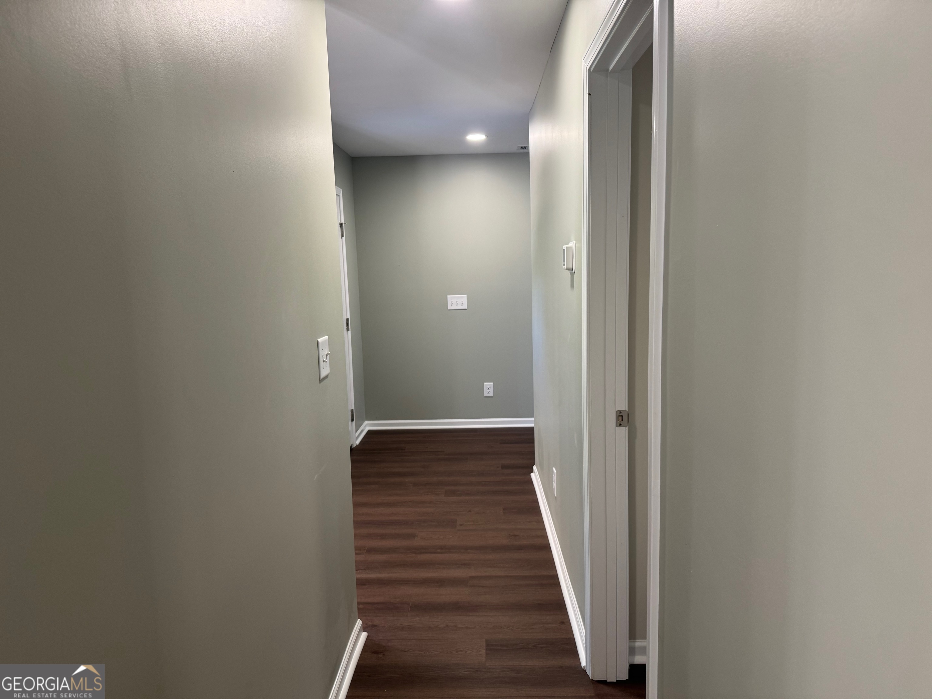 2809 Jones Road Sandersville, GA 31082 - Photo 22 of 31 a view of a hallway with wooden floor