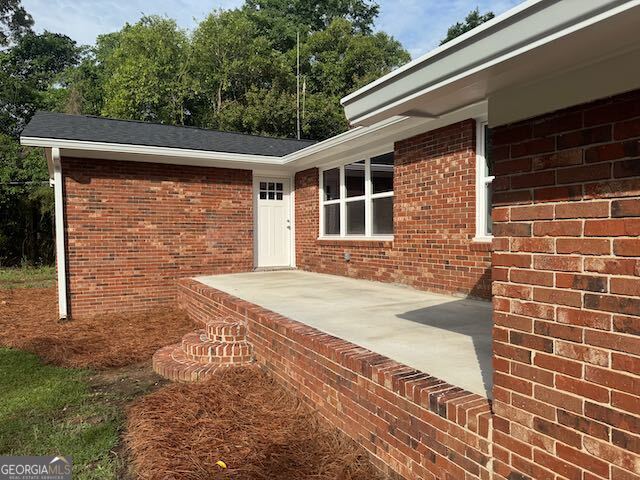 2809 Jones Road Sandersville, GA 31082 - Photo 3 of 31 a front view of a house with a yard