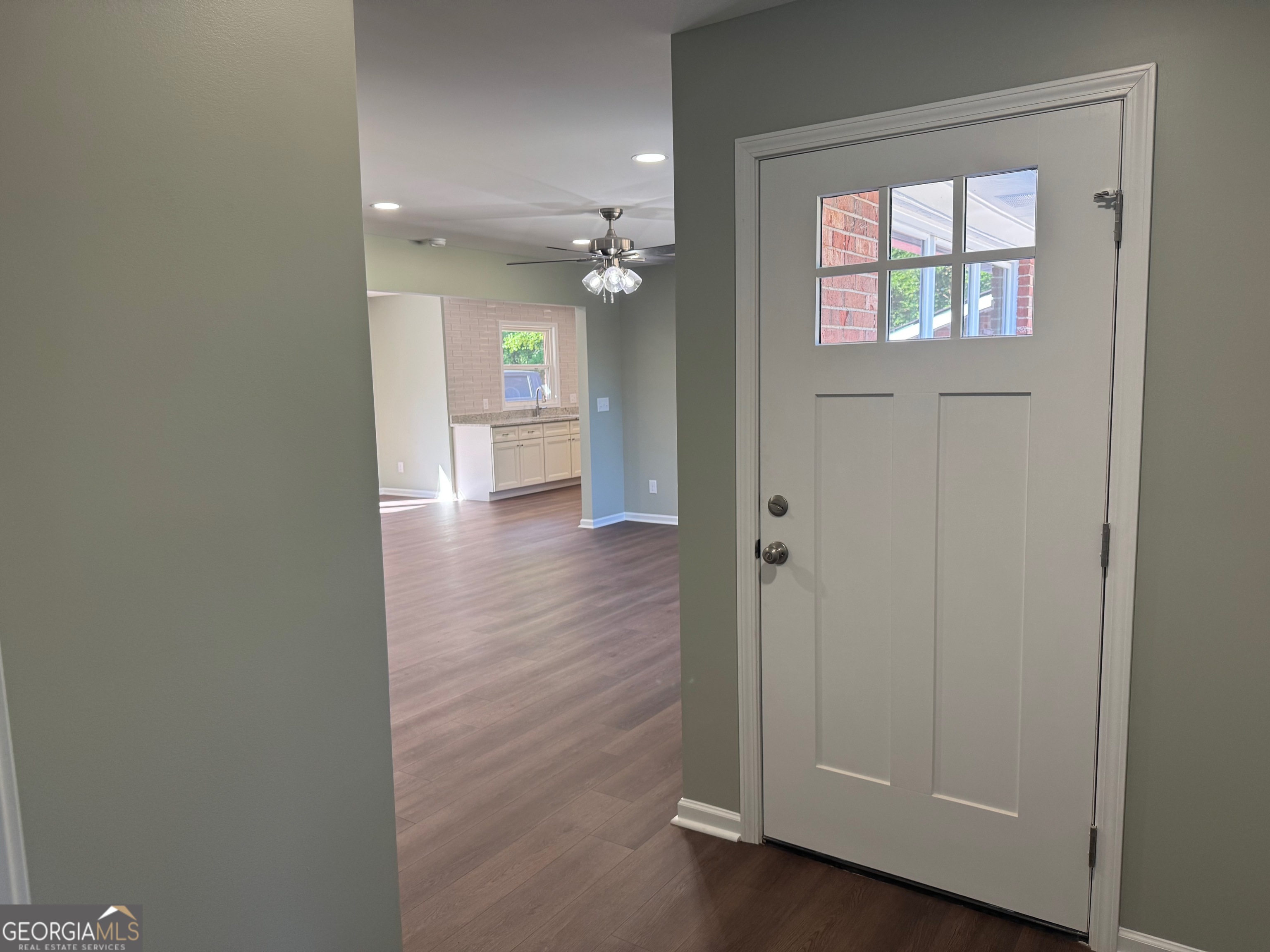 2809 Jones Road Sandersville, GA 31082 - Photo 5 of 31 a view of a hallway with wooden floor