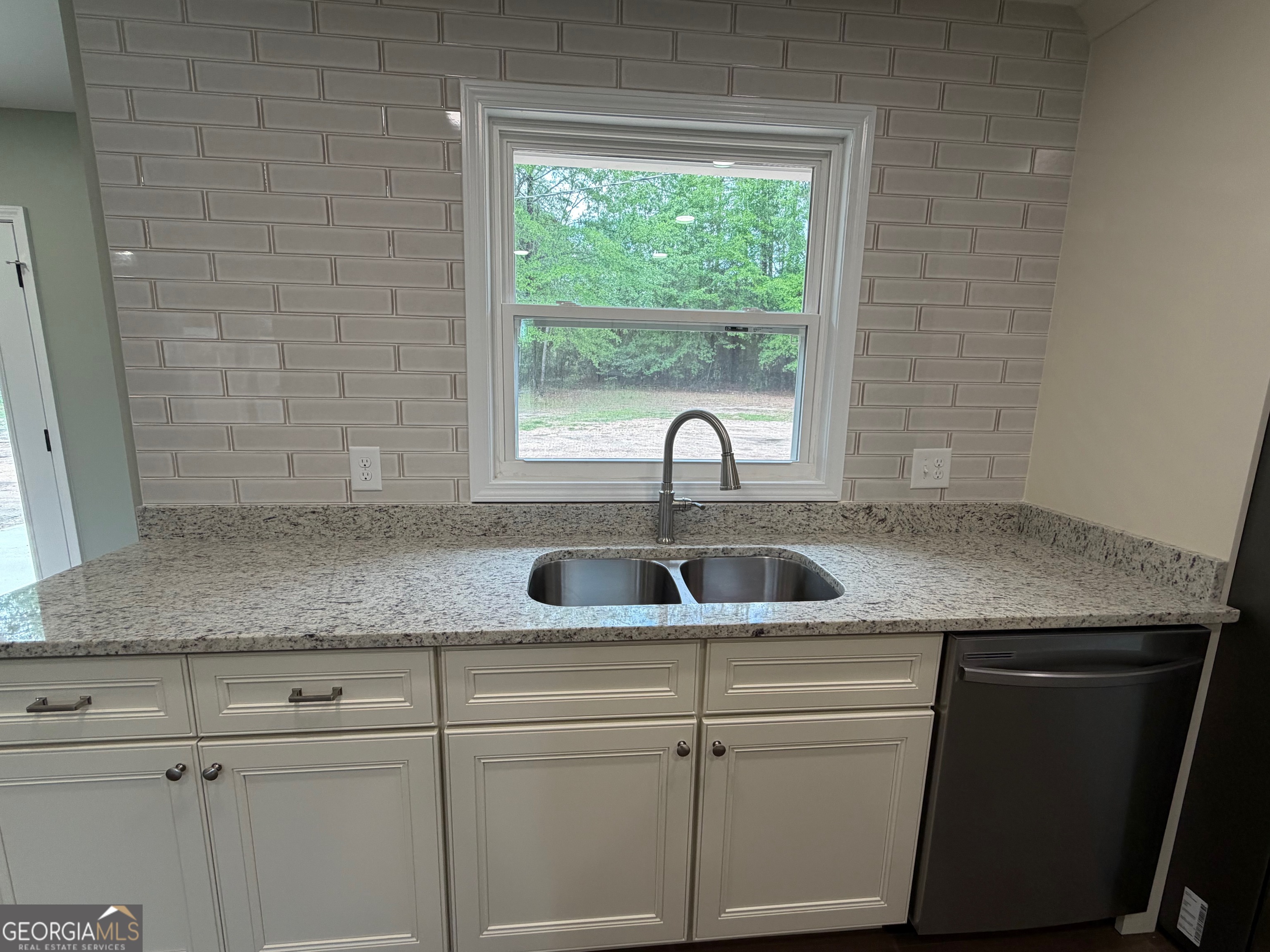 2809 Jones Road Sandersville, GA 31082 - Photo 10 of 31 a kitchen with a sink and a window