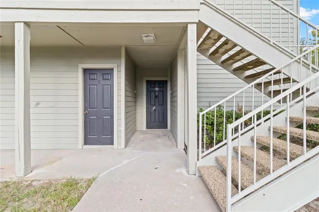 a view of front door and small yard
