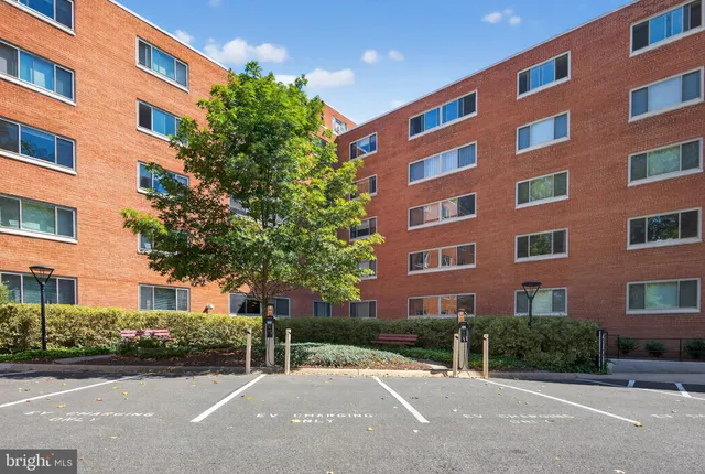 a view of a building next to a yard