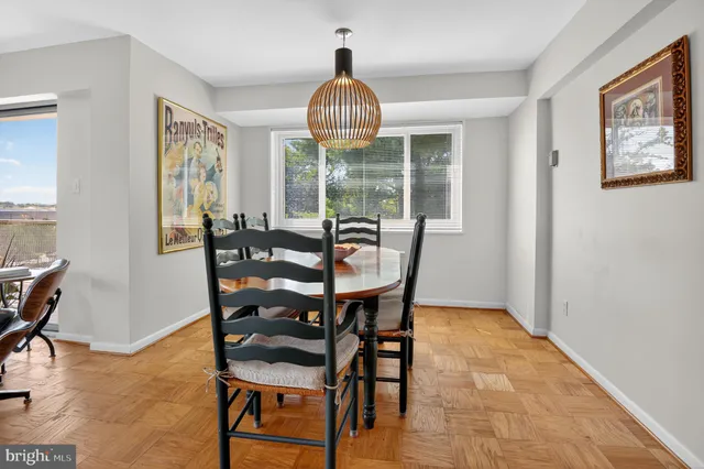 a view of a dining room with furniture window and outside view
