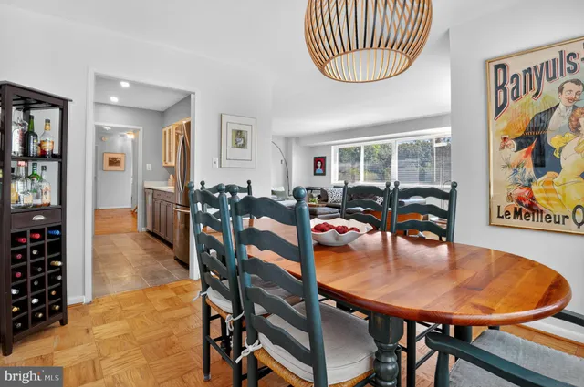 a dining room with furniture and window
