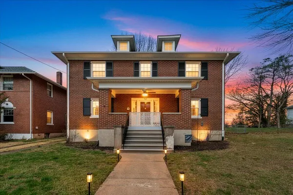 a front view of a house with a yard