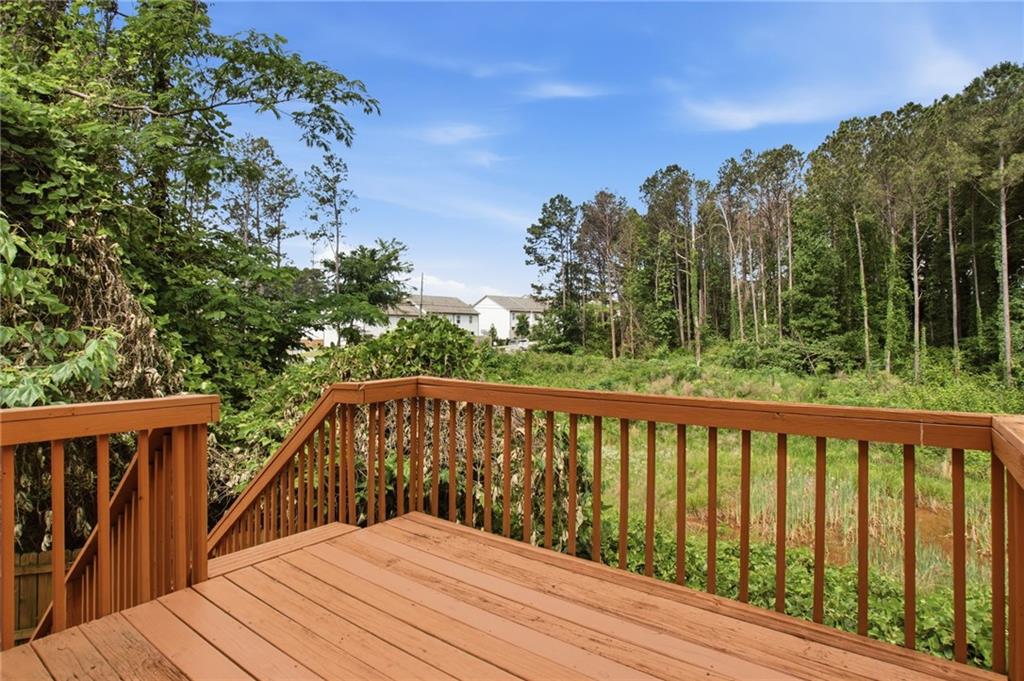 5855 Crescent Ridge Court Lithonia, GA 30058 - Photo 39 of 46 a balcony with wooden floor and fence