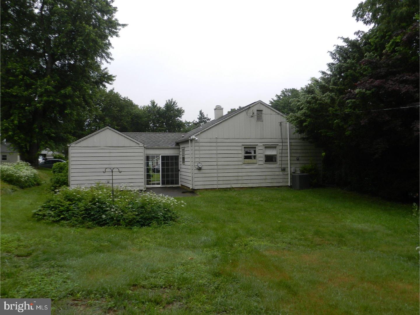 113 Gable Road Paoli, PA 19301 - Photo 12 of 17 a backyard of a house with lots of green space and plants