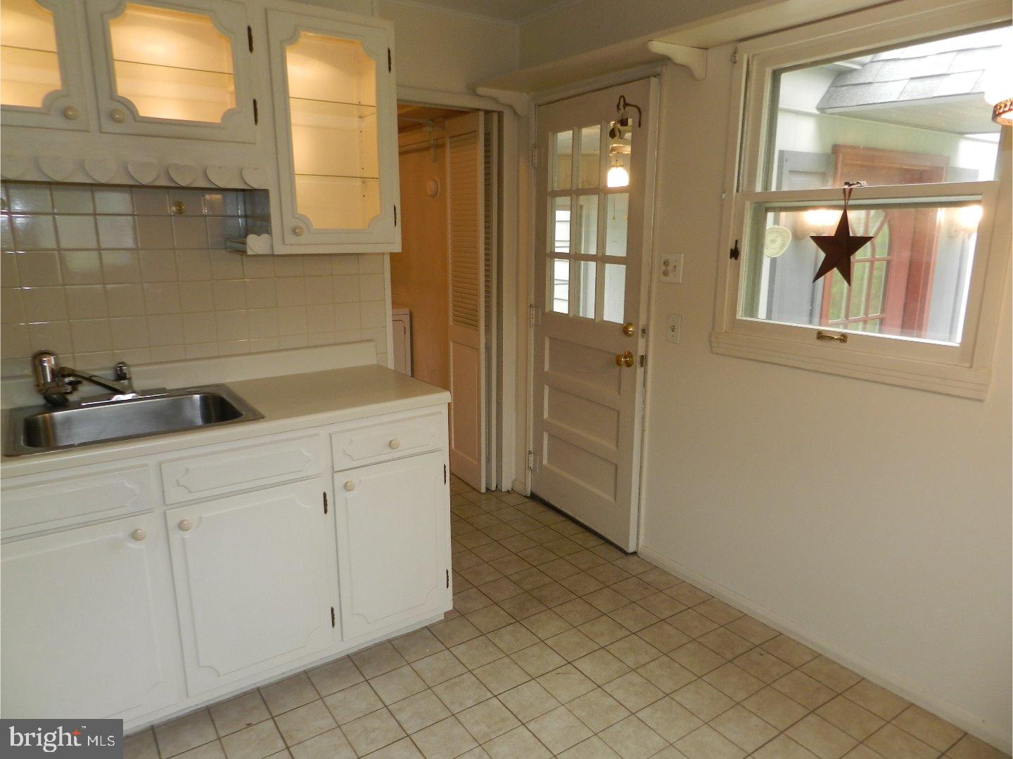 113 Gable Road Paoli, PA 19301 - Photo 3 of 17 a bathroom with a sink and mirror
