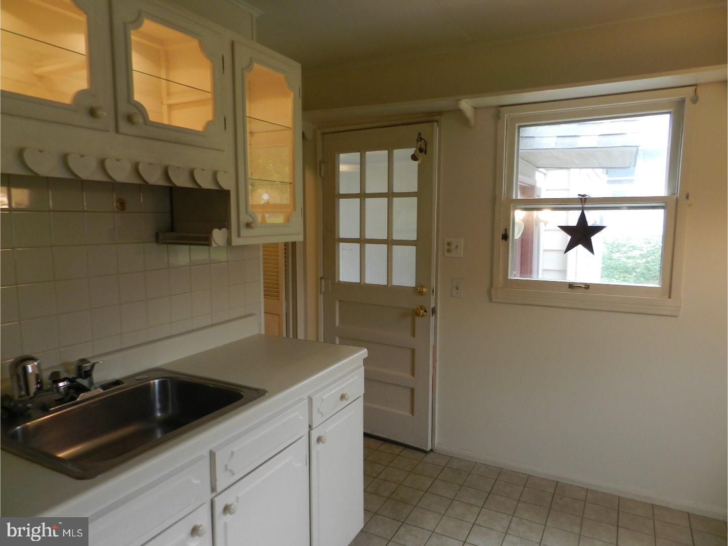 113 Gable Road Paoli, PA 19301 - Photo 4 of 17 a kitchen with a sink and cabinets
