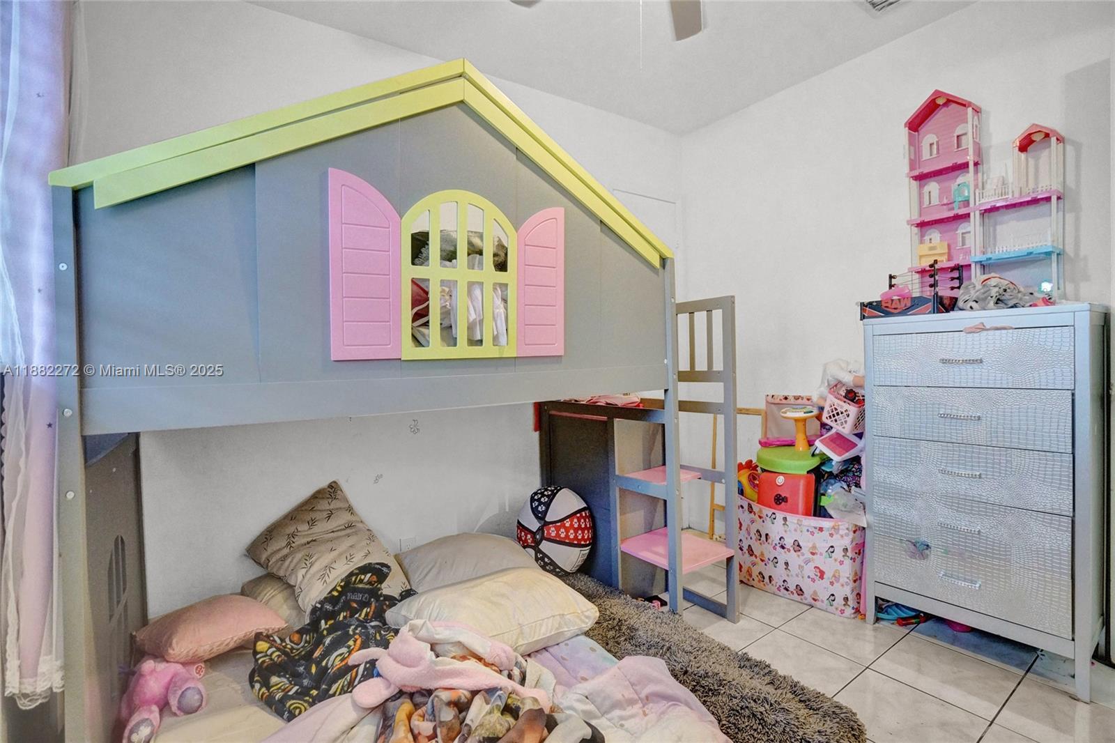 5606 Hayes Street, Unit 2 Hollywood, FL 33021 - Photo 12 of 20 a bed room with a bed and a window