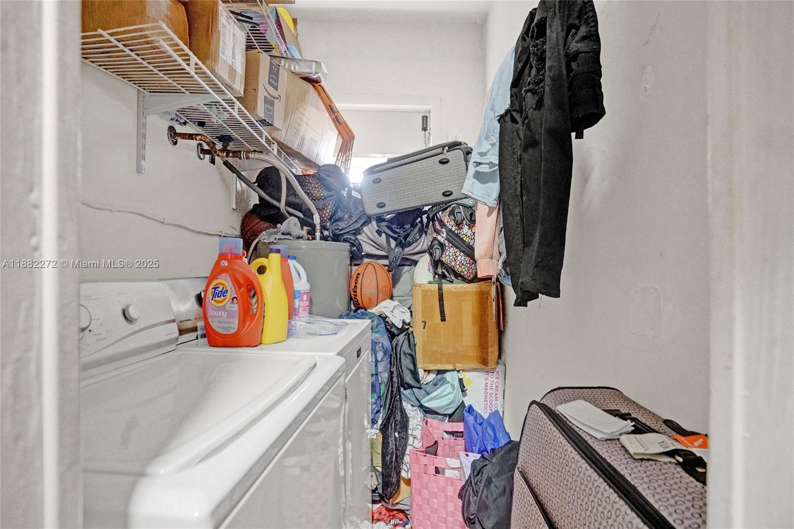 5606 Hayes Street, Unit 2 Hollywood, FL 33021 - Photo 16 of 20 a view of walk in closet with clothes and shoes