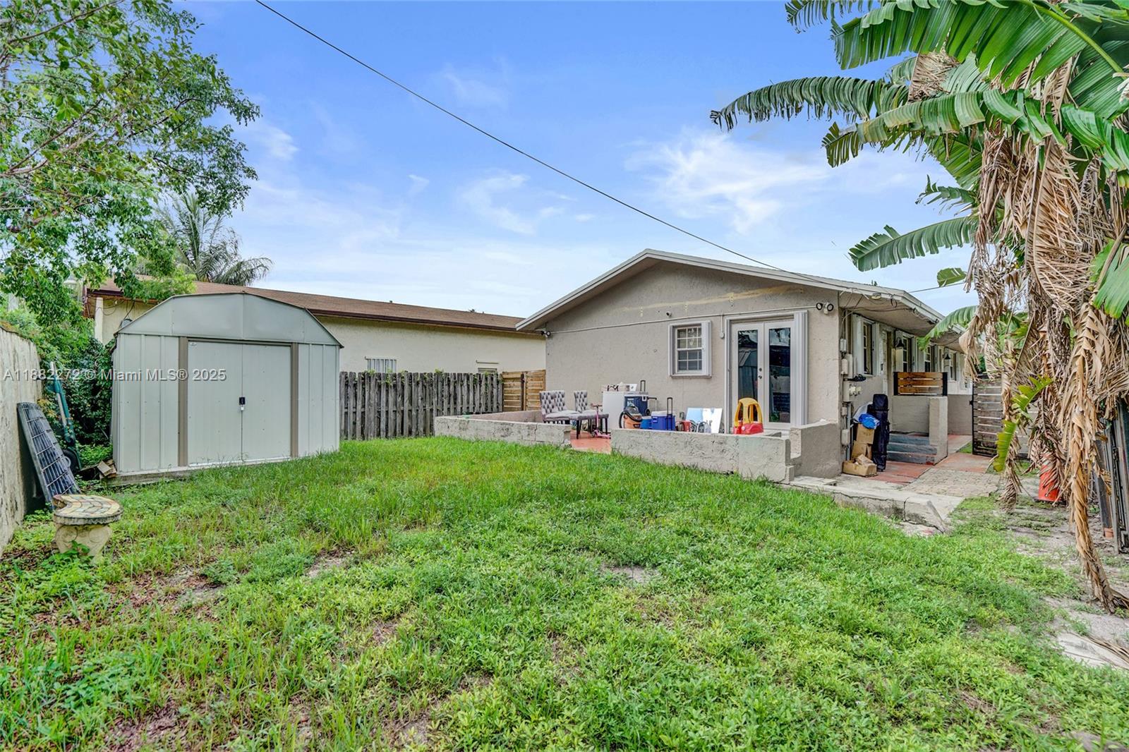 5606 Hayes Street, Unit 2 Hollywood, FL 33021 - Photo 18 of 20 a view of a house with a yard and sitting area