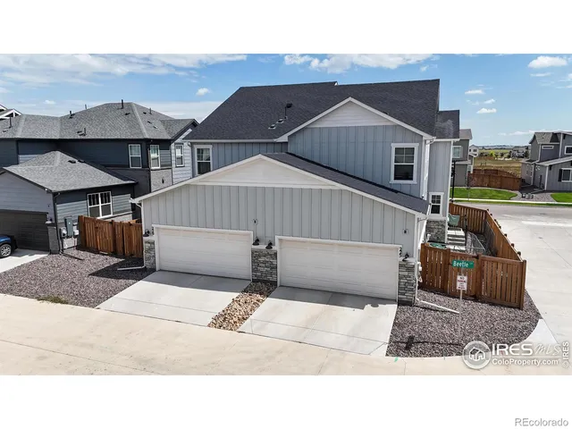 a terrace with outdoor seating city view and ocean view