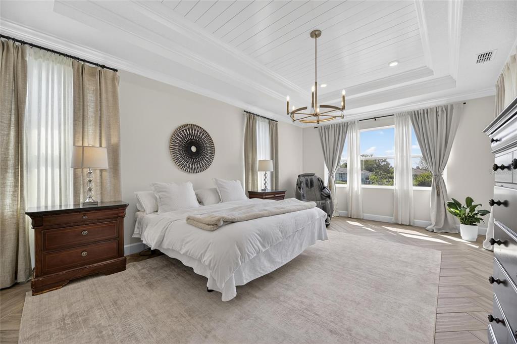 914 Signet Drive Apollo Beach, FL 33572 - Photo 29 of 100 a spacious bedroom with a bed a dresser and large window