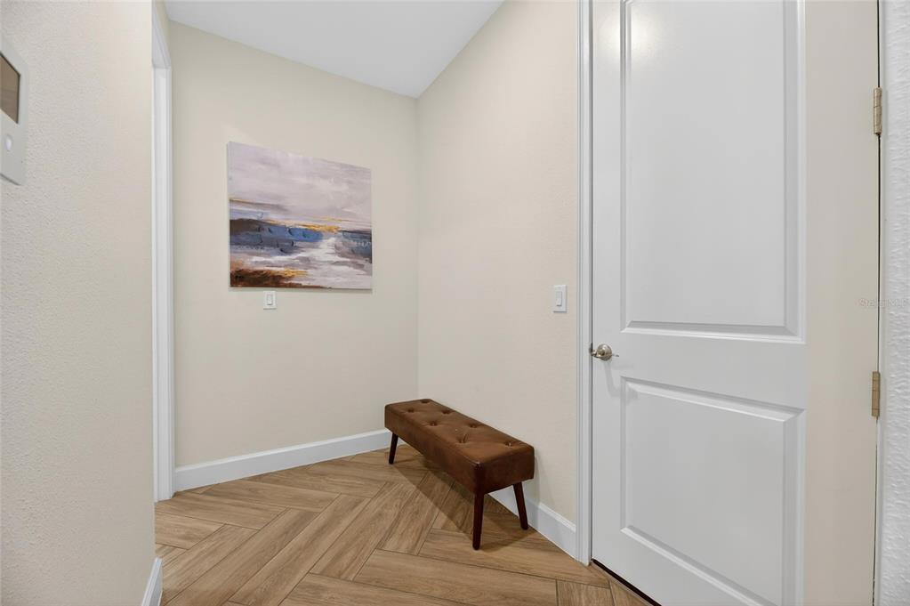914 Signet Drive Apollo Beach, FL 33572 - Photo 45 of 100 a view of a room with a bench and wooden floor