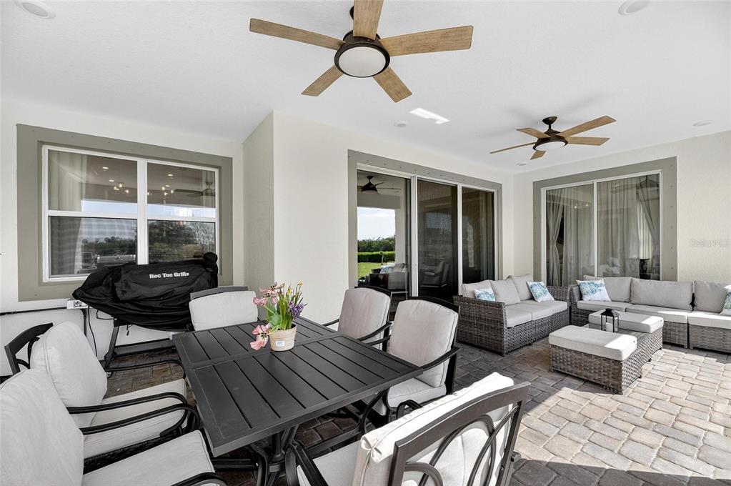 914 Signet Drive Apollo Beach, FL 33572 - Photo 54 of 100 a view of a livingroom and dining room with furniture wooden floor and a chandelier