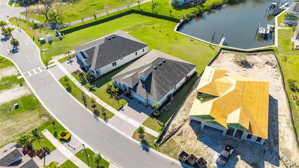 914 Signet Drive Apollo Beach, FL 33572 - Photo 65 of 100 an aerial view of a house with a garden and blue swimming pool