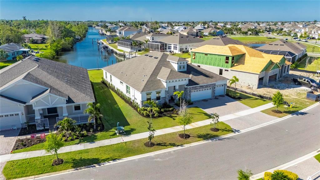 914 Signet Drive Apollo Beach, FL 33572 - Photo 77 of 100 an aerial view of a house with a garden and swimming pool