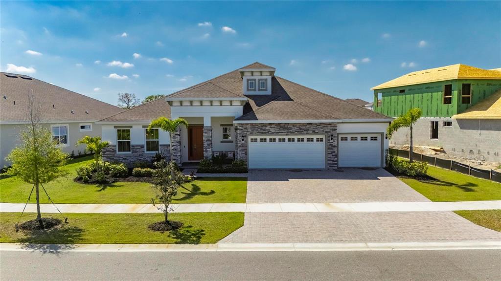 914 Signet Drive Apollo Beach, FL 33572 - Photo 80 of 100 a view of a house with swimming pool and a yard