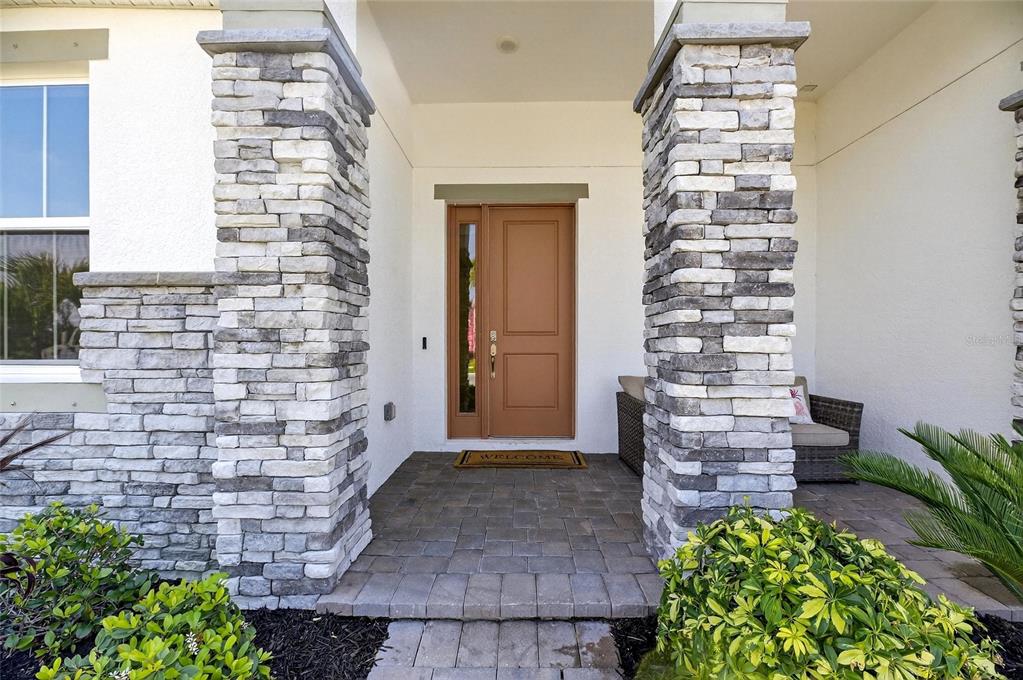 914 Signet Drive Apollo Beach, FL 33572 - Photo 8 of 100 a front view of a house with potted plants