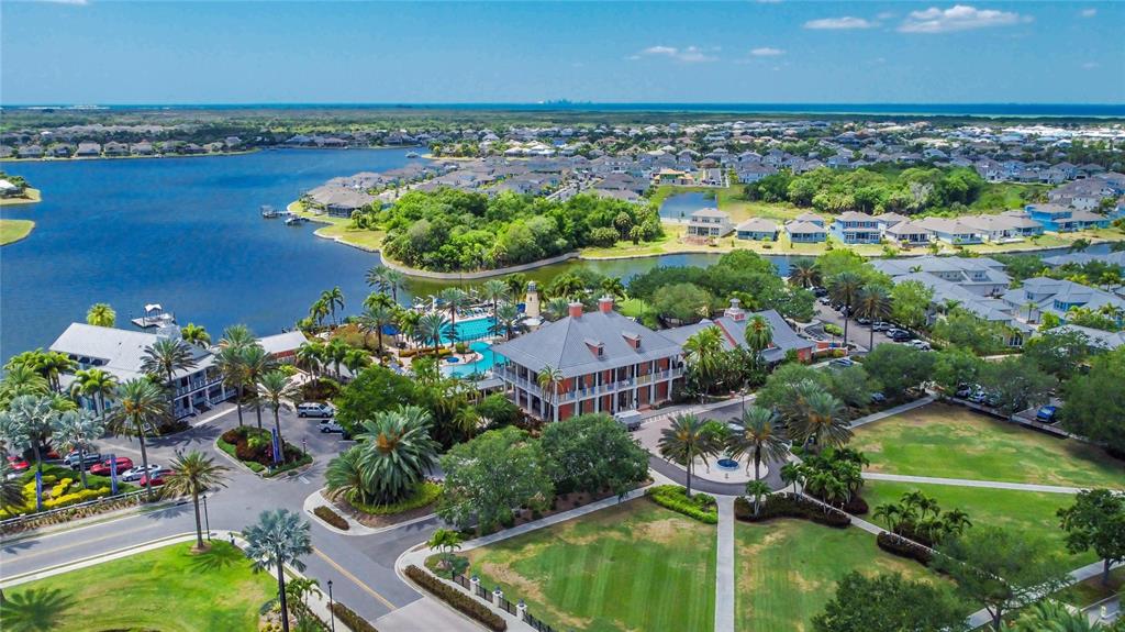914 Signet Drive Apollo Beach, FL 33572 - Photo 94 of 100 an aerial view of a house with a garden and lake view