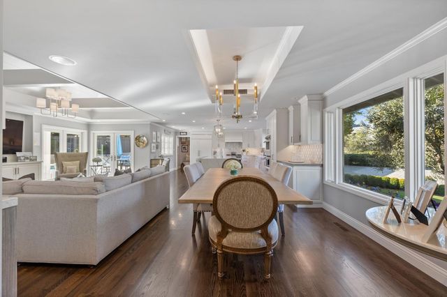 a kitchen with lots of counter top space and painting on the wall