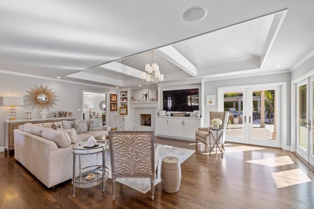 a view of a patio with table and chairs