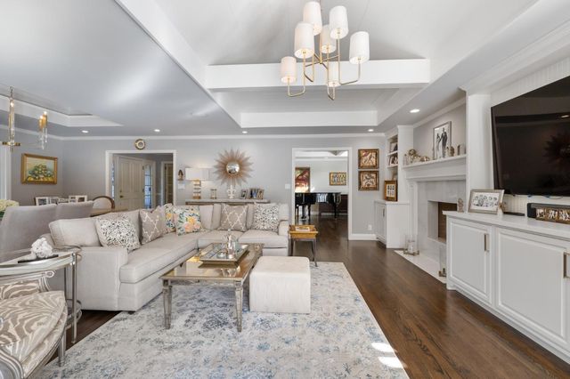 a view of a house with a small yard and a garden