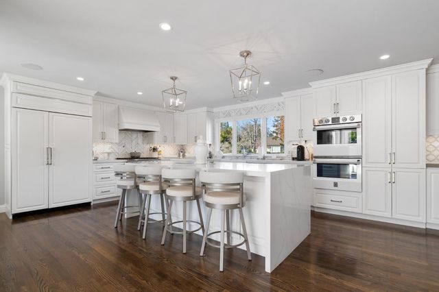 a view of a patio with table and chairs potted plants with wooden fence