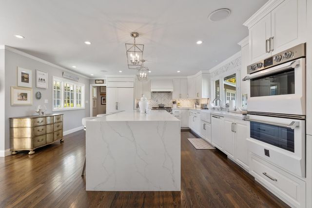 a view of a garden with a house